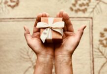 5 Tech-Savvy Valentine’s Day Gift Ideas for the One You Love person s holds brown gift box